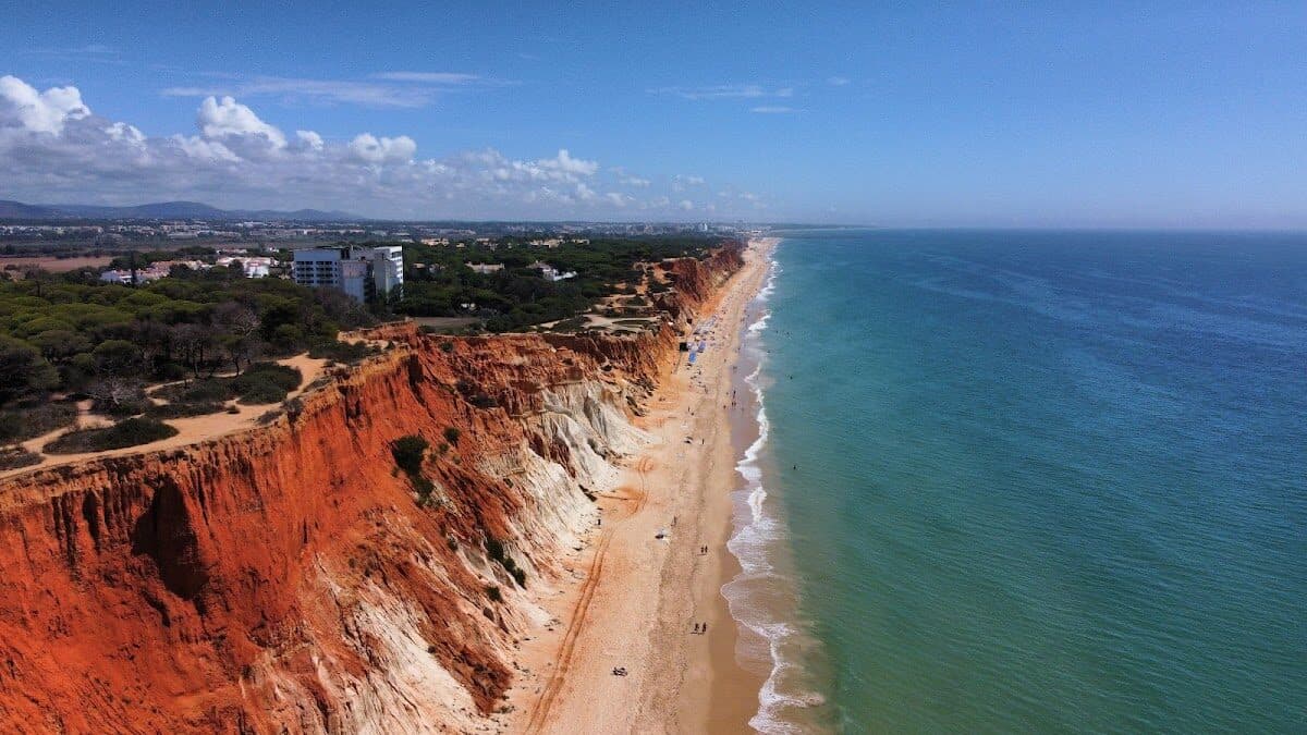 Blue Flag flying over a Portuguese beach with golden sand